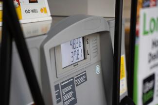 a close up of a gas pump at a gas station by Krzysztof Hepner courtesy of Unsplash.