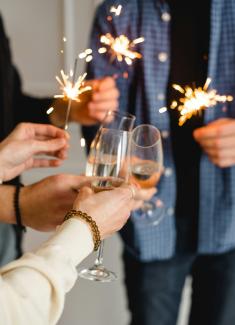 woman in white long sleeve shirt holding clear wine glass by Kateryna Hliznitsova courtesy of Unsplash.