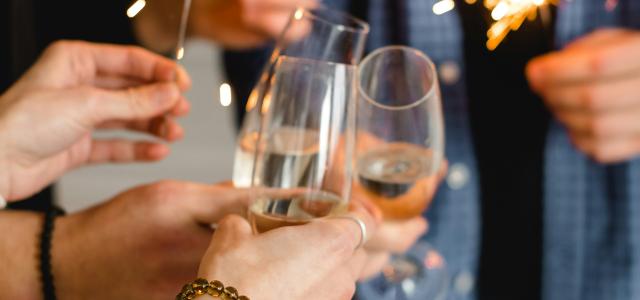 woman in white long sleeve shirt holding clear wine glass by Kateryna Hliznitsova courtesy of Unsplash.