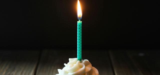 taper candle on cupcake by Angèle Kamp courtesy of Unsplash.